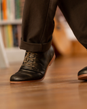 Juniper Cat Desert Boot, worn on a wood floor