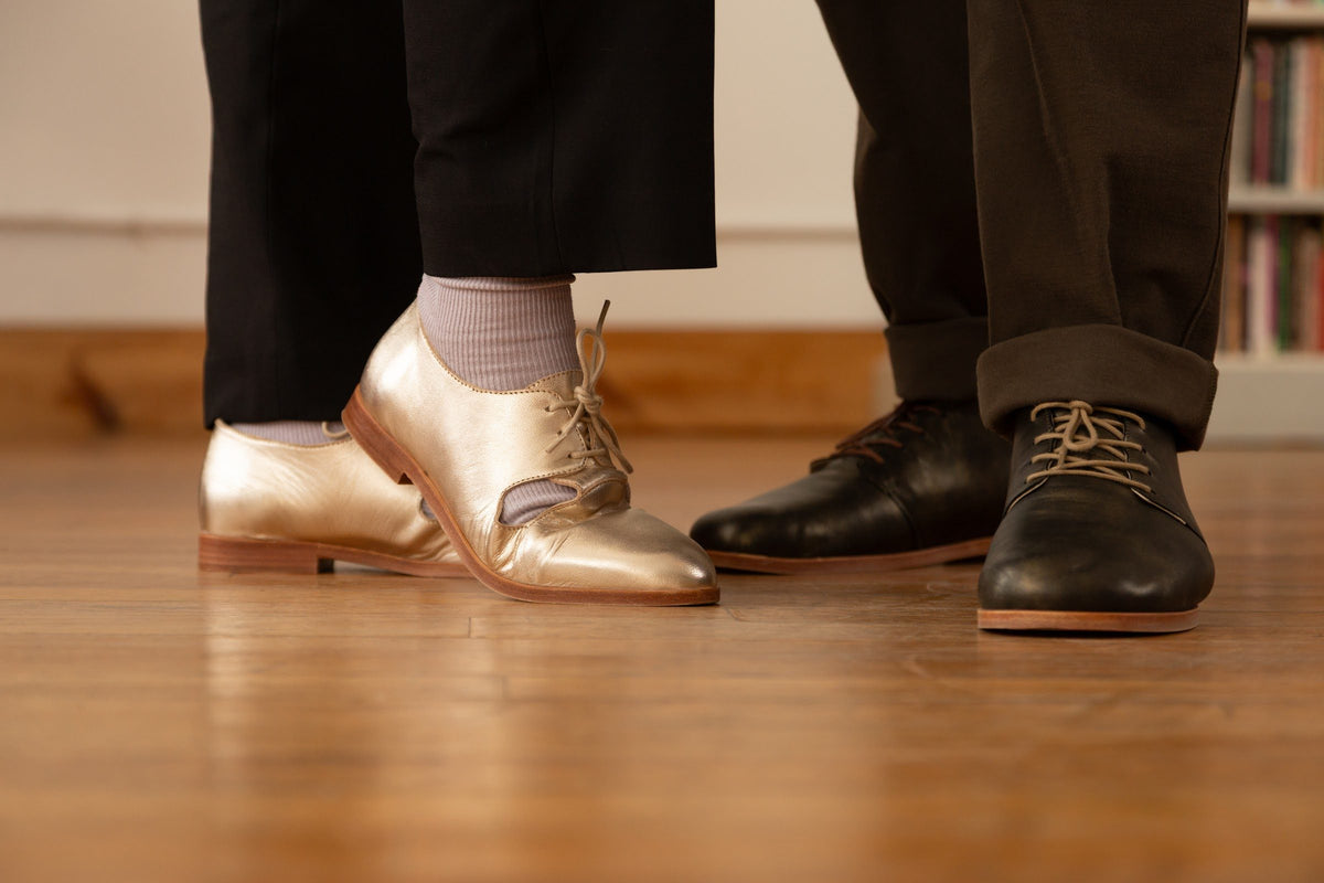 Gold and black marleys on a wooden dance floor